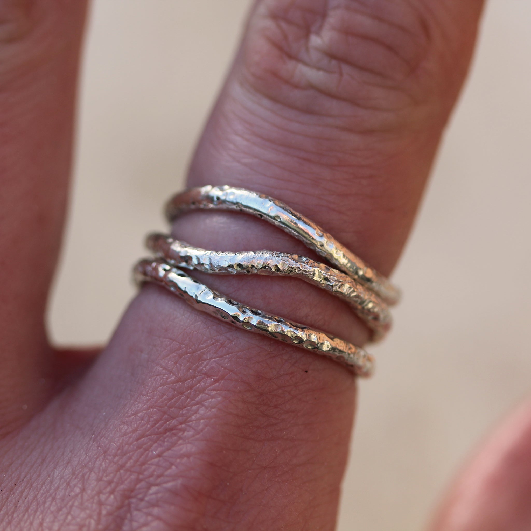 Sterling silver stacking rings inspired by the sea and handmade in 100% recycled metals