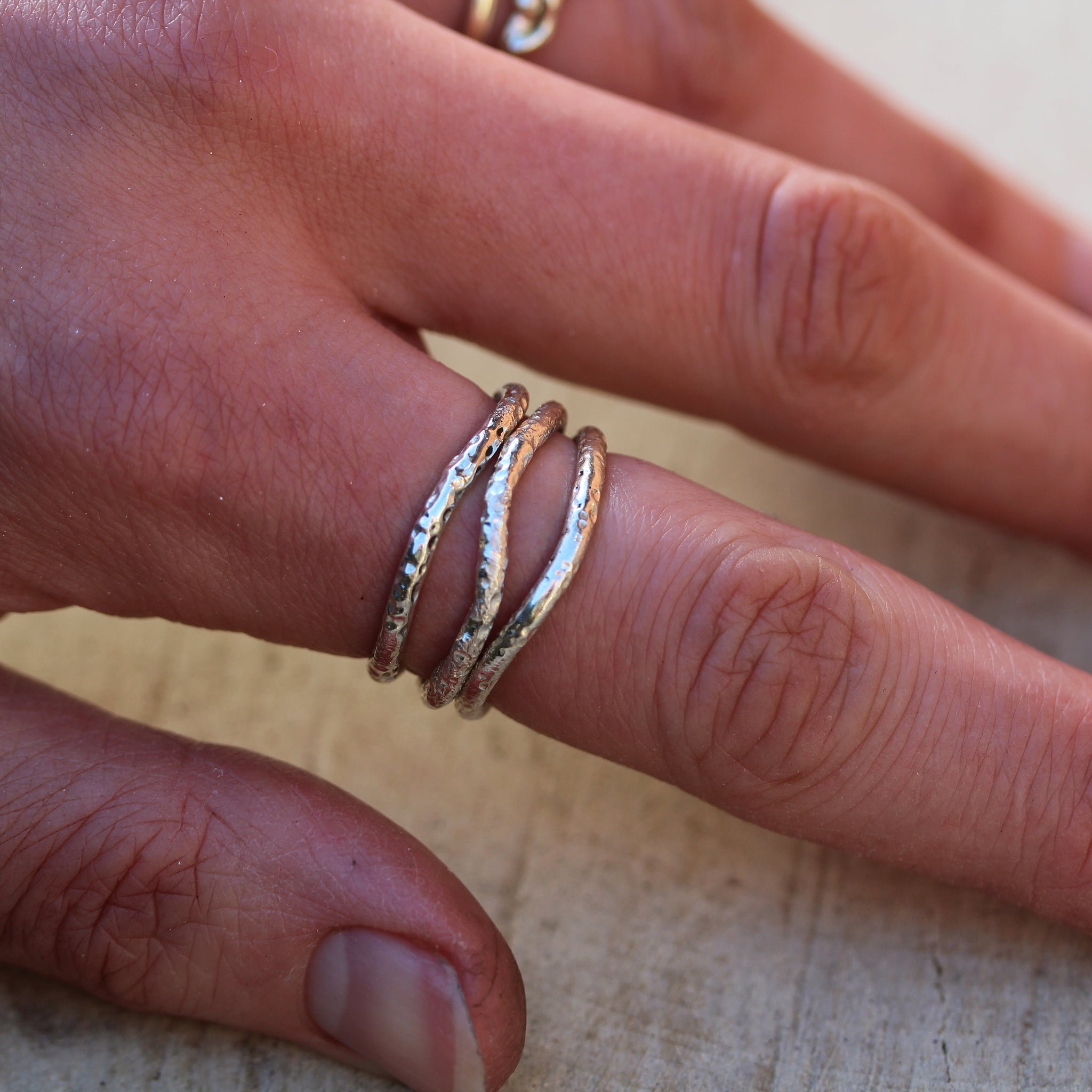 Sterling silver stacking rings inspired by the sea and handmade in 100% recycled metals
