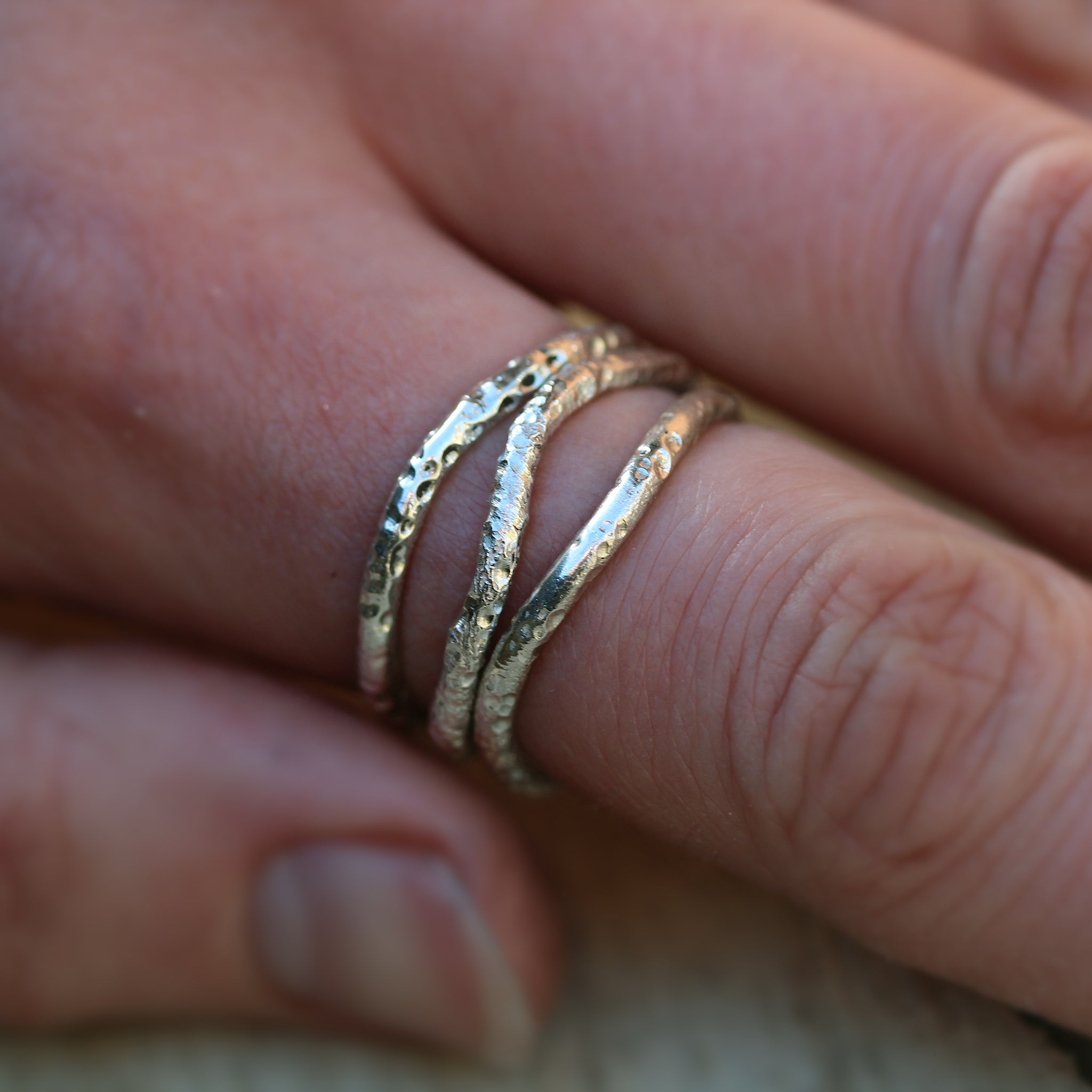 Sterling silver stacking rings inspired by the sea and handmade in 100% recycled metals