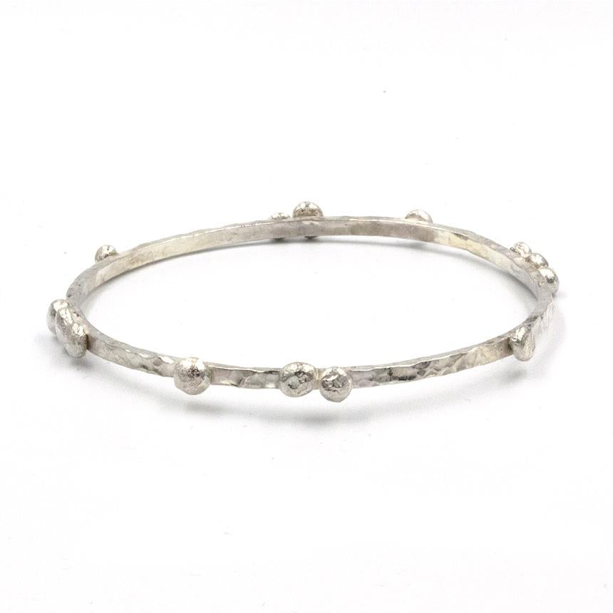 Handcrafted Pebbles on the Beach Bangle, inspired by the pebbley shorelines of Suffolk and handmade in Sterling Silver 