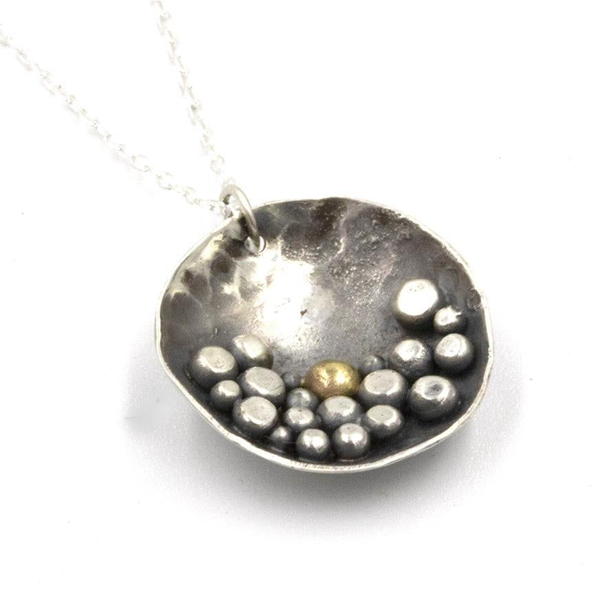 Pebbles on the Beach inspired sterling silver necklace, featuring a deep patina and silver pebble details 