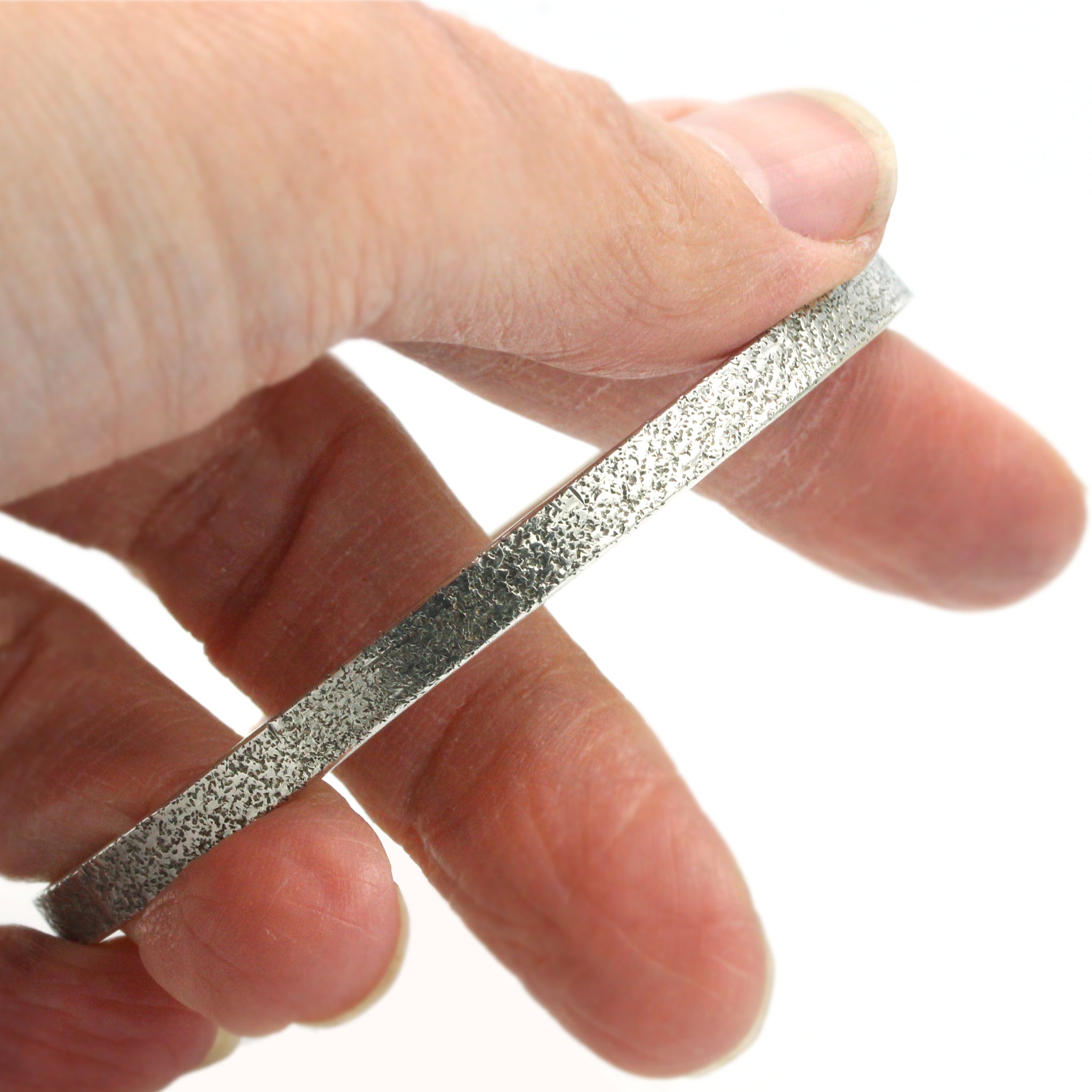 Sand textured silver bangle, handmade in 100% recycled silver
