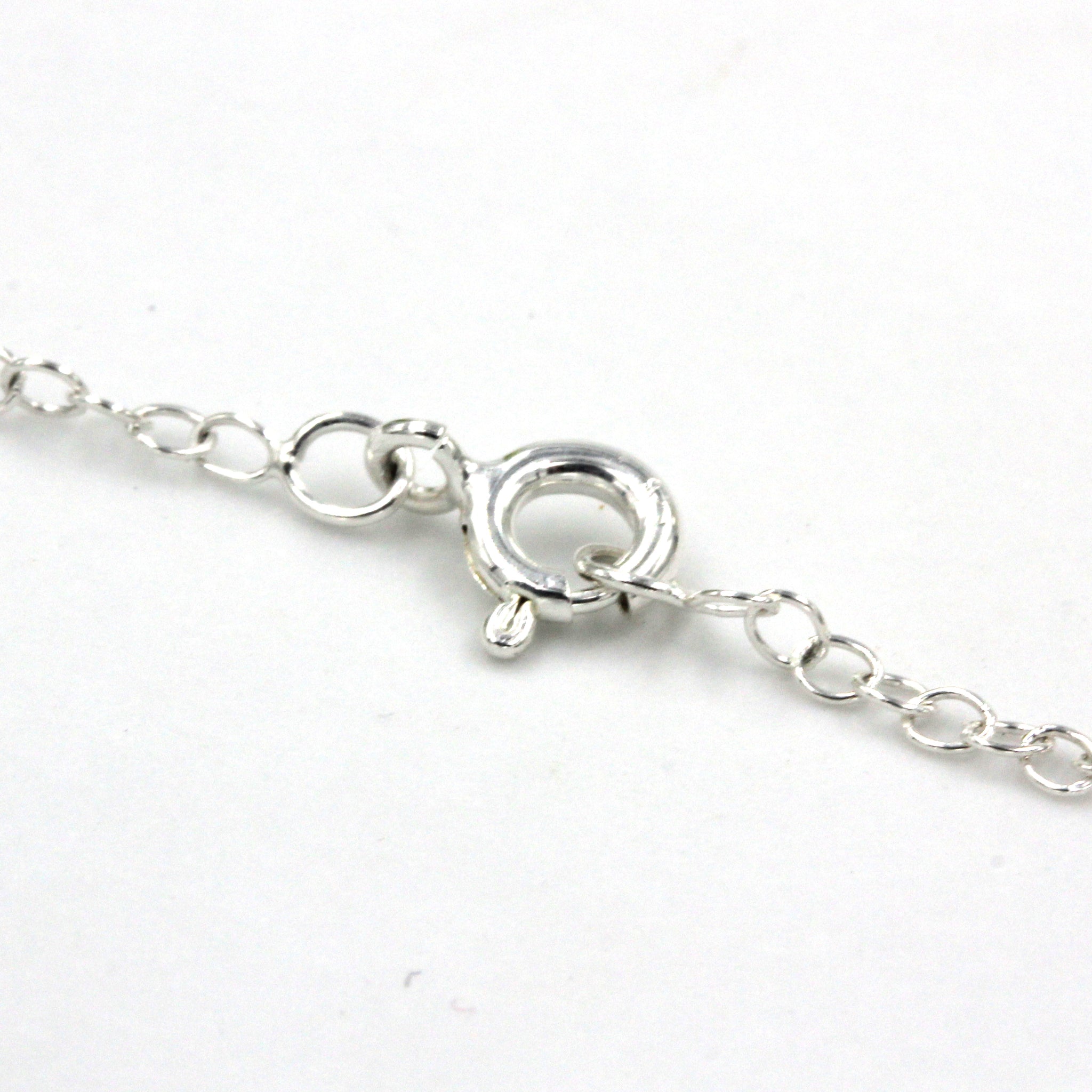 Close up details of a sterling silver necklace clasp
